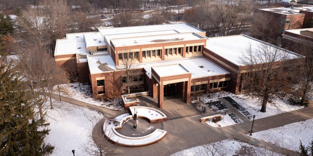 Aerial photo of the Libe covered in snow as the sun sets.
