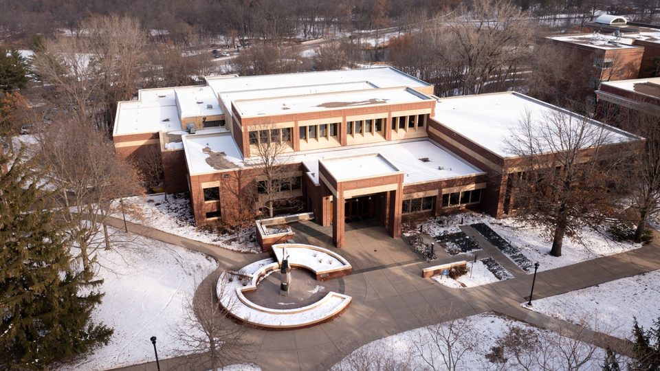 Aerial photo of the Libe covered in snow as the sun sets.