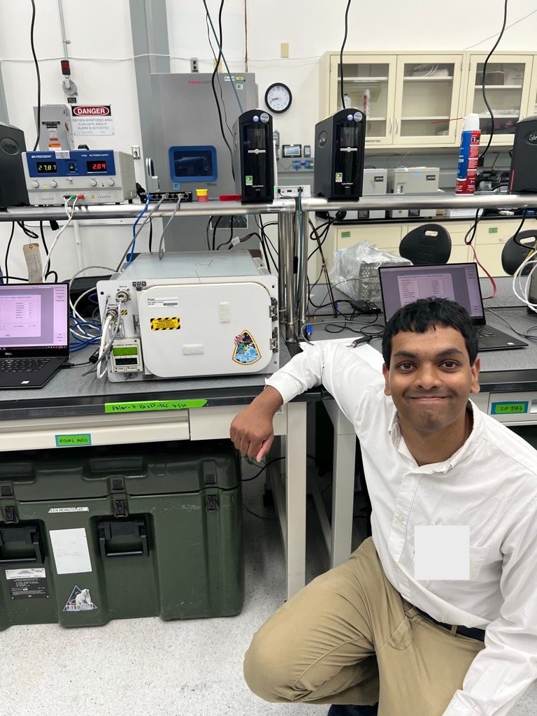 Jithran Ekanayake ’20 poses with the container that will take his experiments to space.
