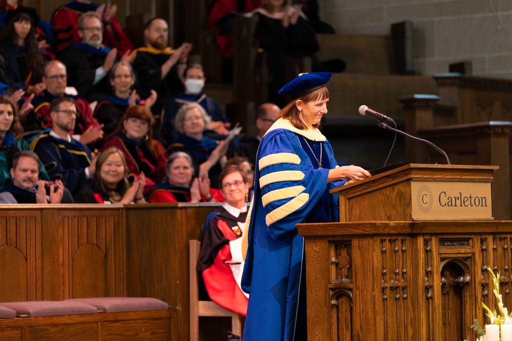 President Alison Byerly addresses a crowd from the Chapel stage.