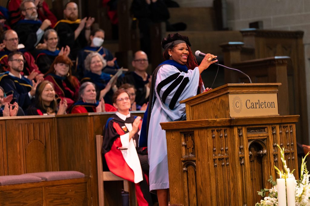 Dr. Kellie Carter Jackson adjusts her microphone on the Chapel stage.