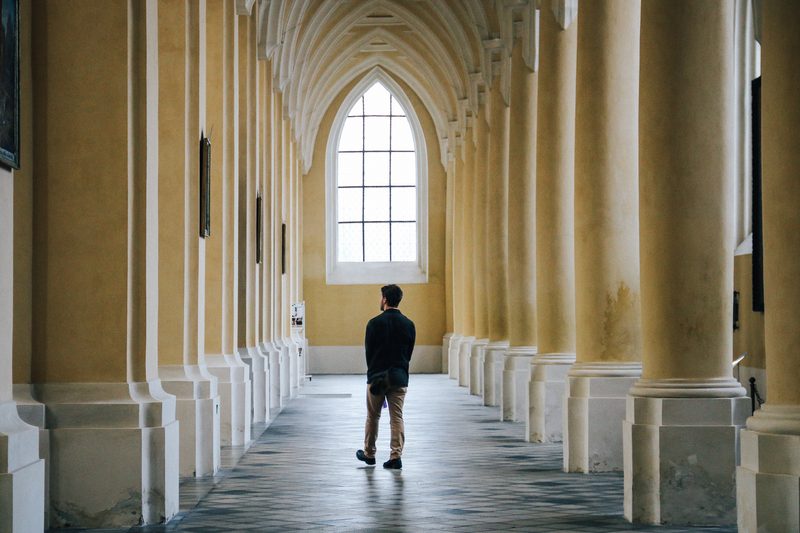 Student walking in old building