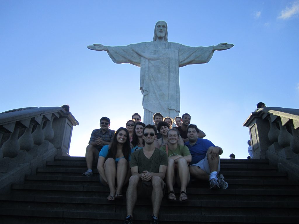 Students pose in front of the Cristo Redentor statue Corcovado Mountain in Brazil