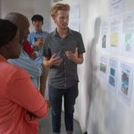 Student presents his independent research project to community members