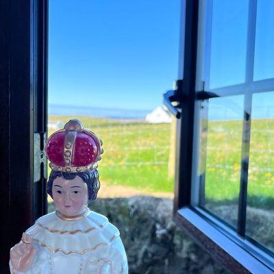 sacred figurine in window