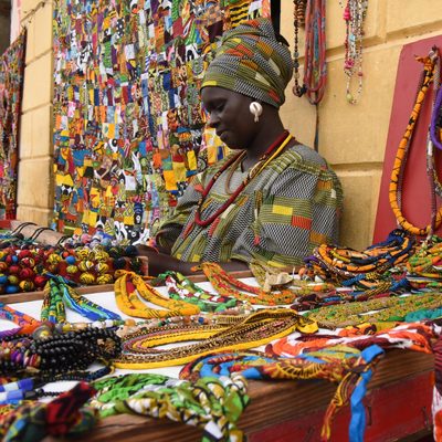 woman selling arts and crafts in Senegal
