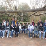 Group Photo Under Wooden Structure