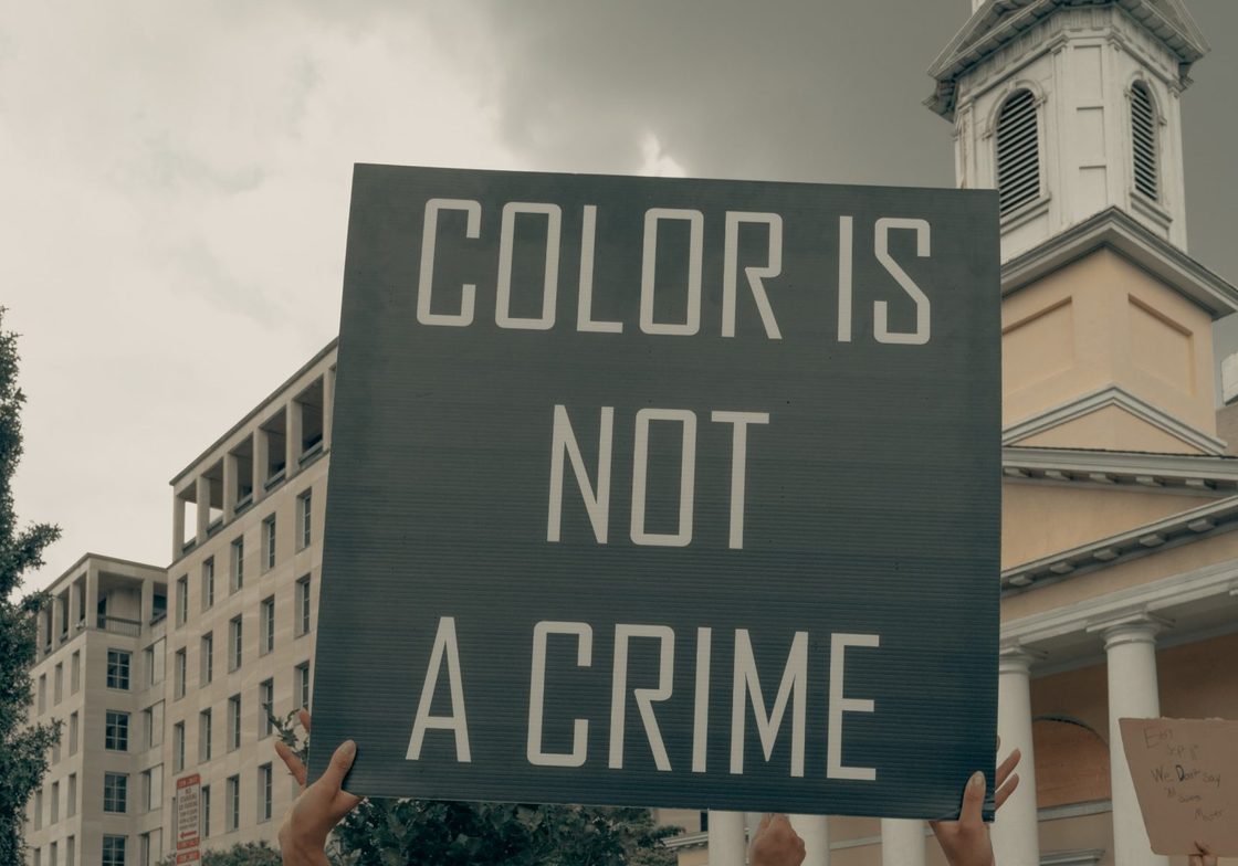 Color is Not a Crime Sign and Protesters