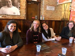 Faculty and Students at a restaurant after presenting their research at MULS