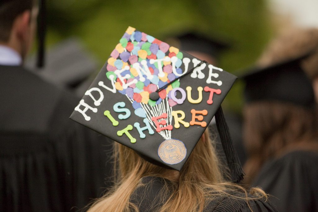 Mortar Board reading "adventure is out there"