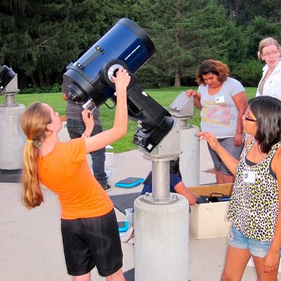 YASE students set up telescopes just before sunset.
