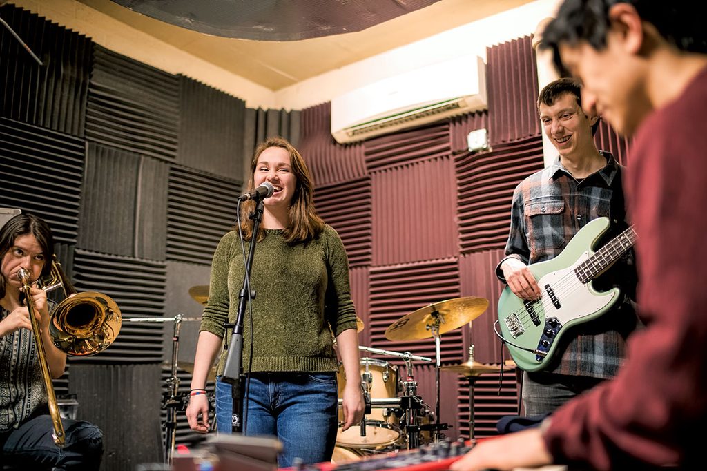 Student band rehearsing in a practice room