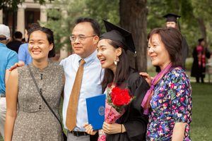 A graduate and her family at commencement