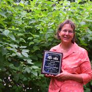 Arboretum director Nancy Braker with Carleton's 2015 Forest Stewardship Award