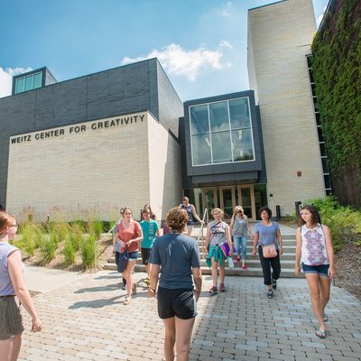 A group of people outside the Weitz Center for Creativity