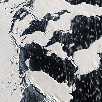 Peeling and dripping white paint on a black surface
