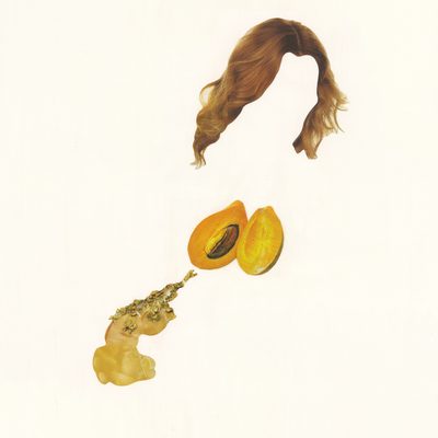 A faceless figure in three-quarter view, formed by collaged images of flowing auburn hair above a split mango which leaks a golden fluid.