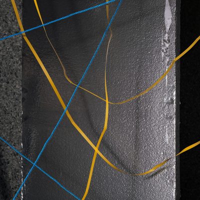 Blue and yellow strings crisscross reflective insulation