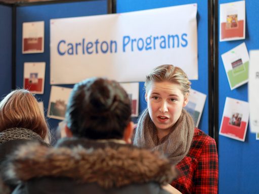 Students and staff talk at the OCS fair