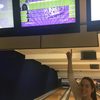 a student points to a bowling alley scoreboard