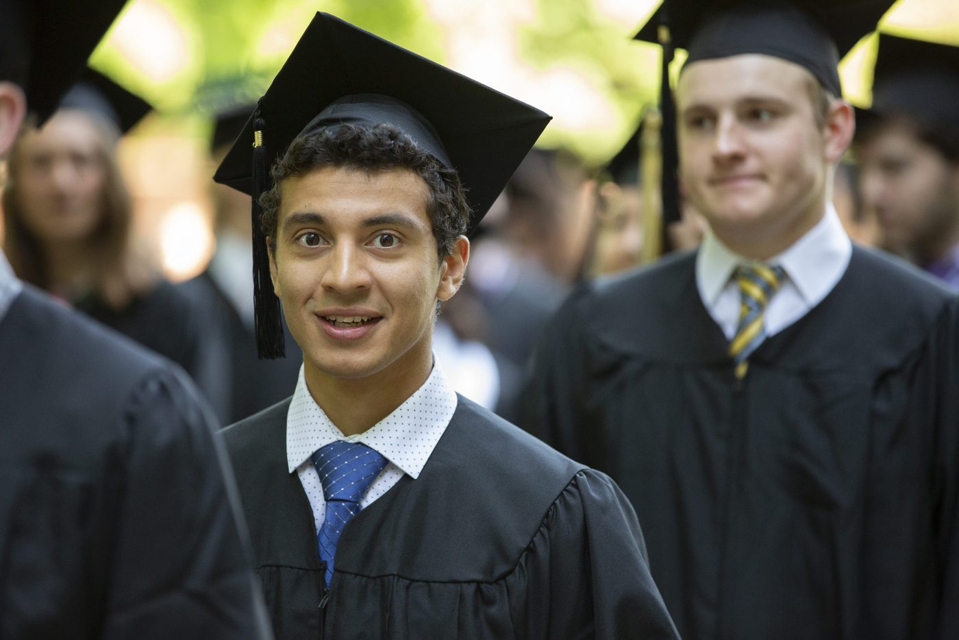 Smiling Carleton graduate at commencement
