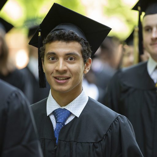 Smiling Carleton graduate at commencement