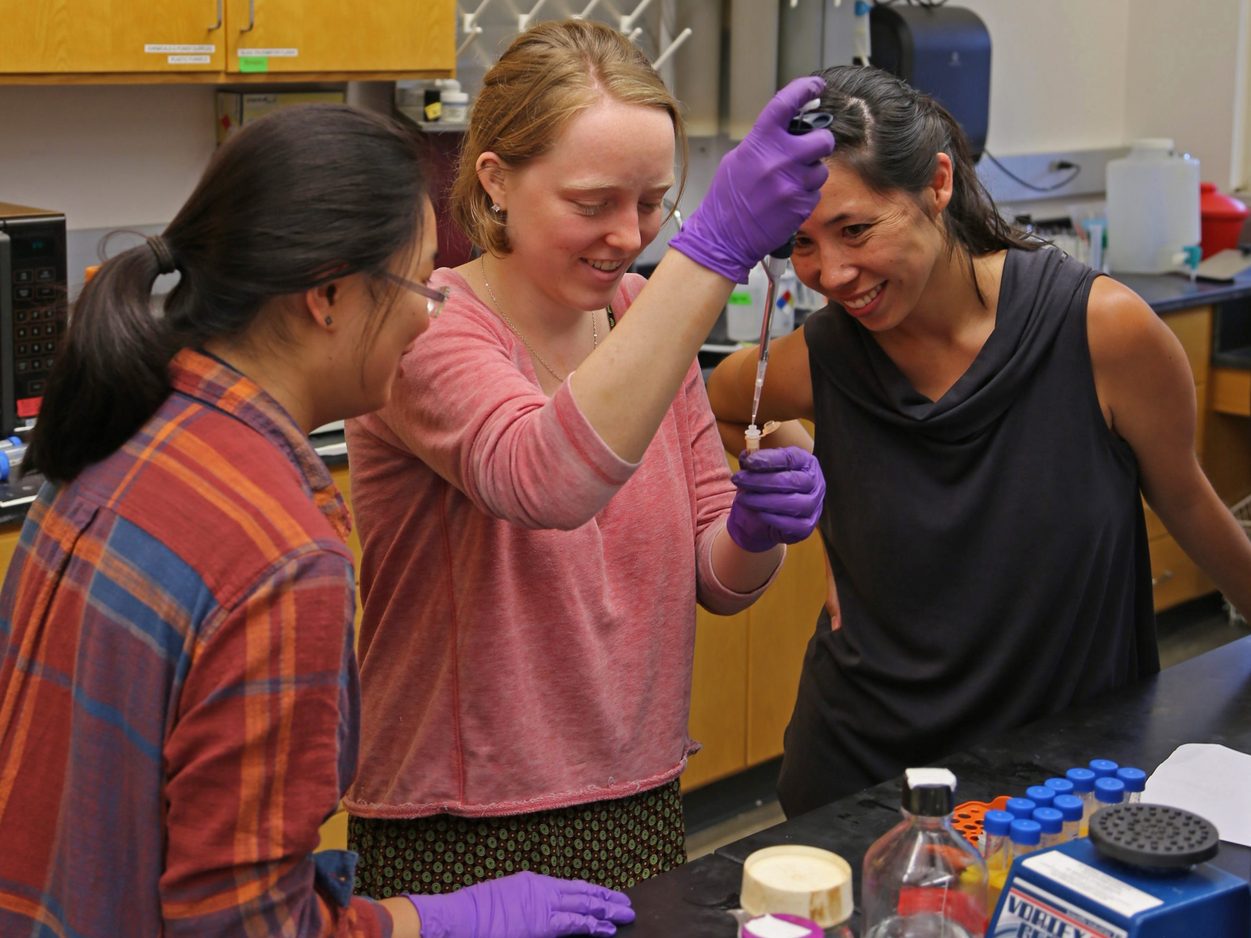 Rika Anderson and students in a biology lab