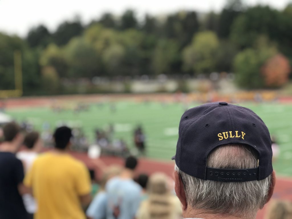 Watching a football game from the stands