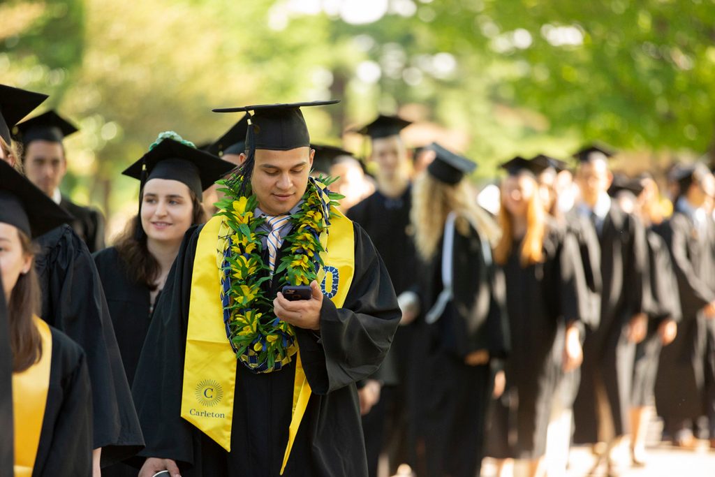 A long line of students at commencement