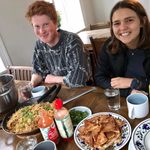 Carleton students enjoy an Icelandic Dinner, Raven Dawson '22 and Tali Emlen '22 Eating Dinner in Dalvík, Northern Iceland