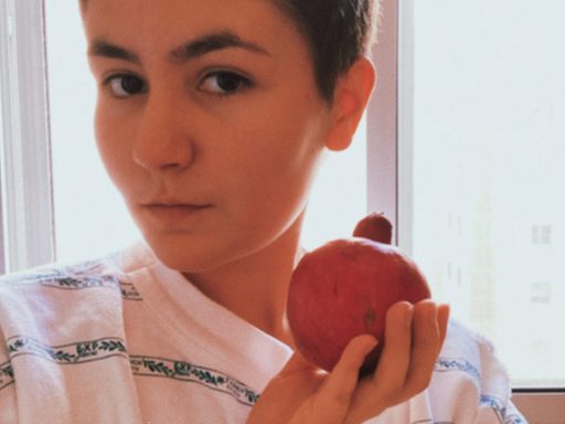 Dasha Palenova holding a pomegranate (rimon in Hebrew).
