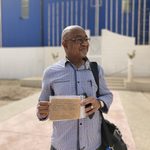 Cherif holding his father's military papers in Senegal