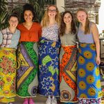 5 students posing with African skirts Senegal