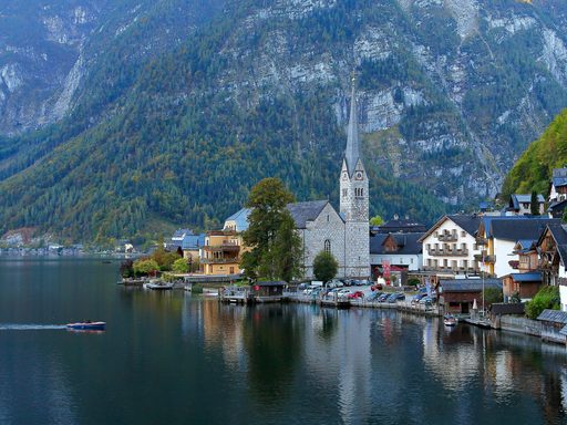 Hallstatt - Castle on water with mountains in the back in austria