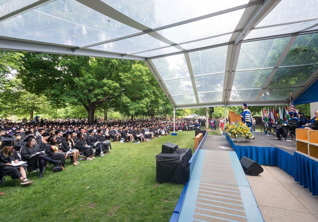 Stage and graduates seated at Commencement 2022