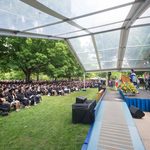 Stage and graduates seated at Commencement 2022