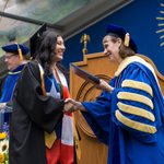 Graduate receiving diploma from President Byerly