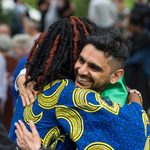 hugging a graduating student.
