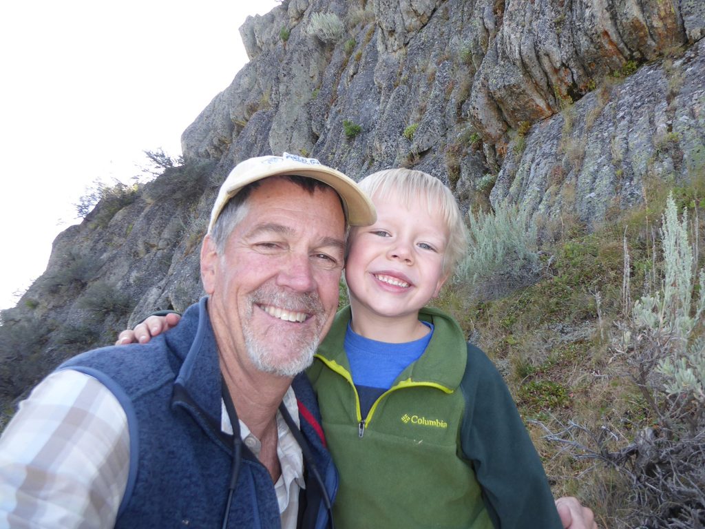 smiling man with small boy