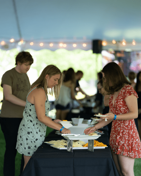 Banquet attendees grab appetizers