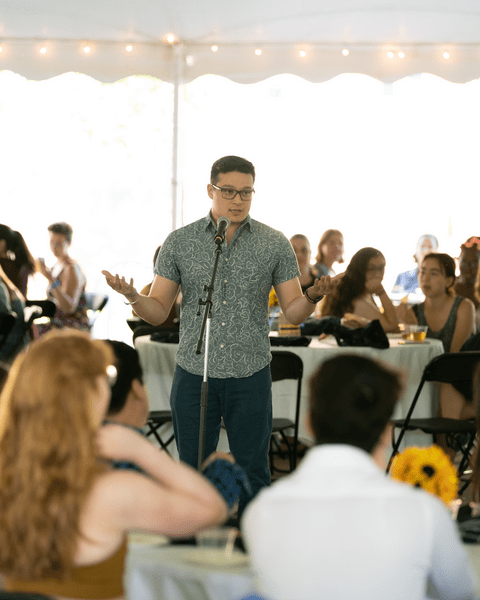 Carlos Lua Pineda '20 speaks at the 2022 Senior Banquet
