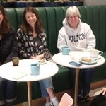 Social gathering at a coffee shop of Carleton alumni