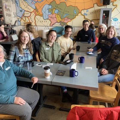 Social gathering of Carleton alumni at a coffee shop