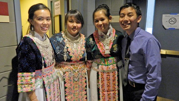 Four students, three in traditional Hmong attire