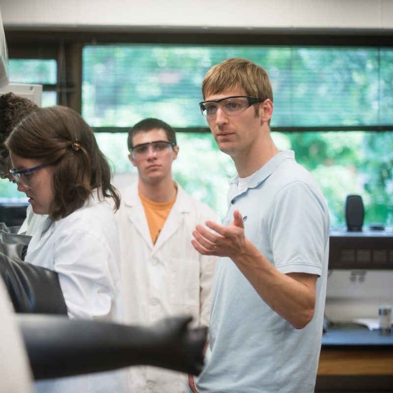 Matt Whited watches over students in the Carleton science research lab.