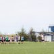 students playing frisbee on a field