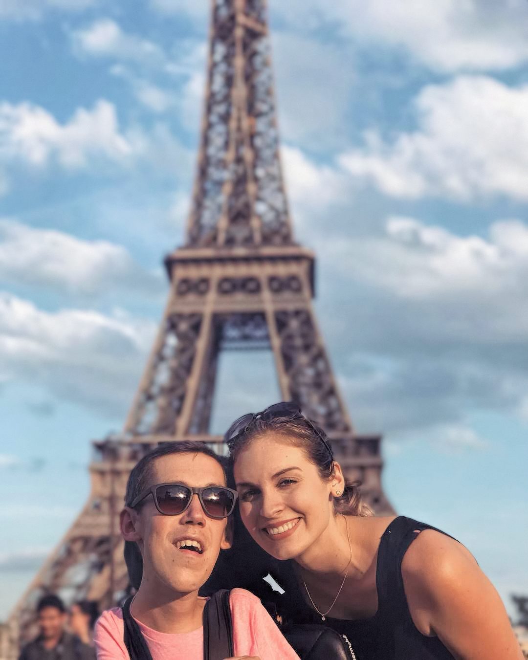 Aylward and Burcaw pose at the Eiffel Tower