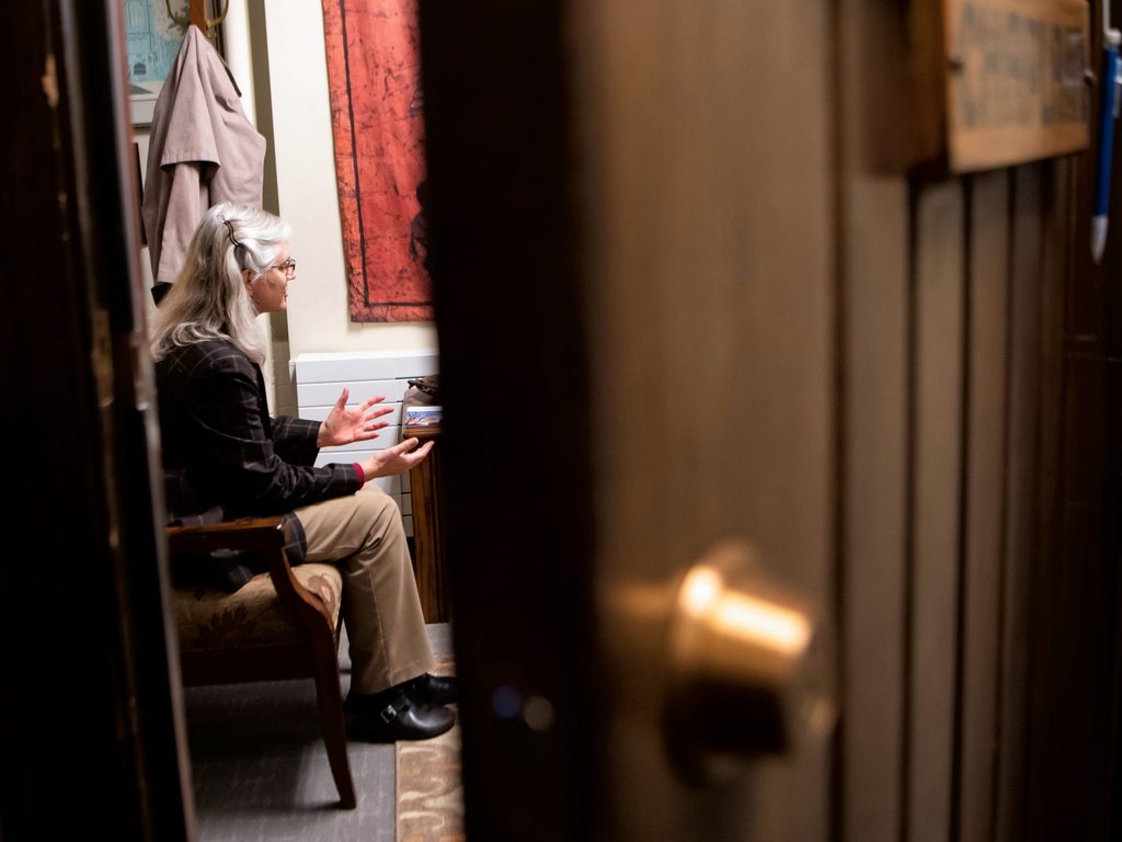 Carolyn Fure-Slocum counseling a student in her office