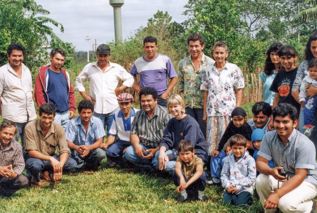 Bev Nagel ’75 with a community group in San Pedro del Ycuámandiyú, Paraguay, in November 2005
