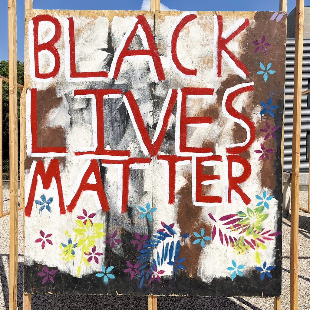 Spray-painted sign: Black Lives Matter